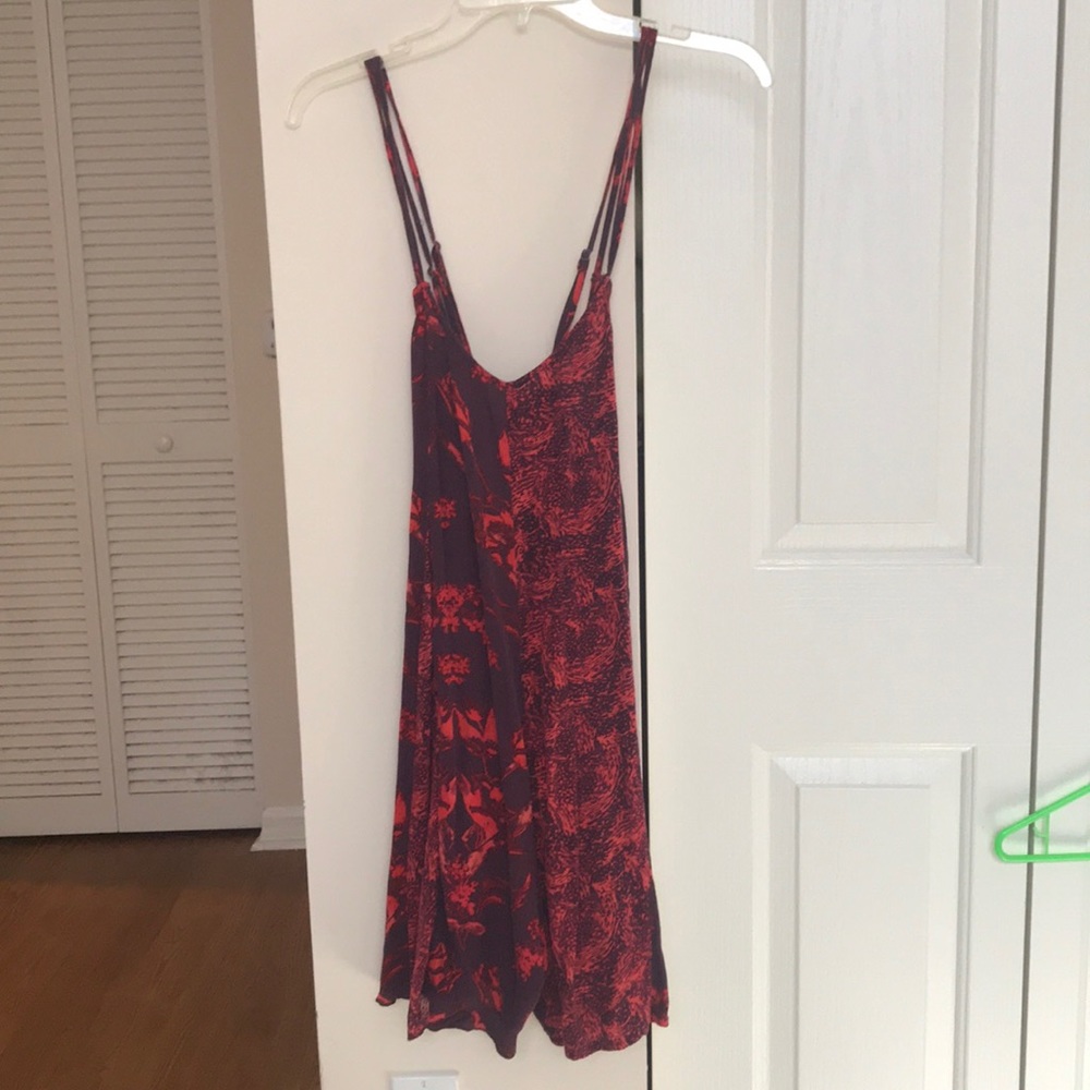 Free people- cross strap romper. Never worn